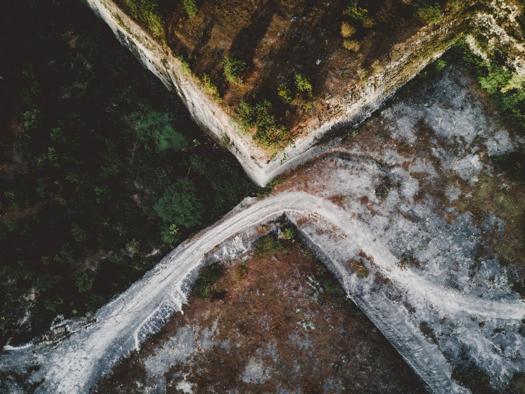 high angle photo of body of water near mountain range