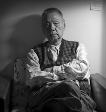 A veteran looking thoughtfully at a denied claim letter, symbolizing struggle.