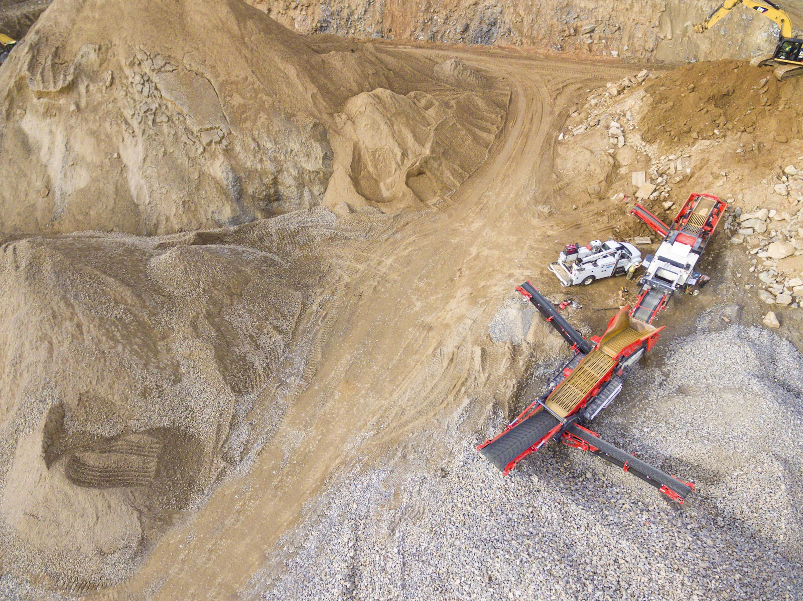 Aerial view of stone quarry with heavy mining equipment