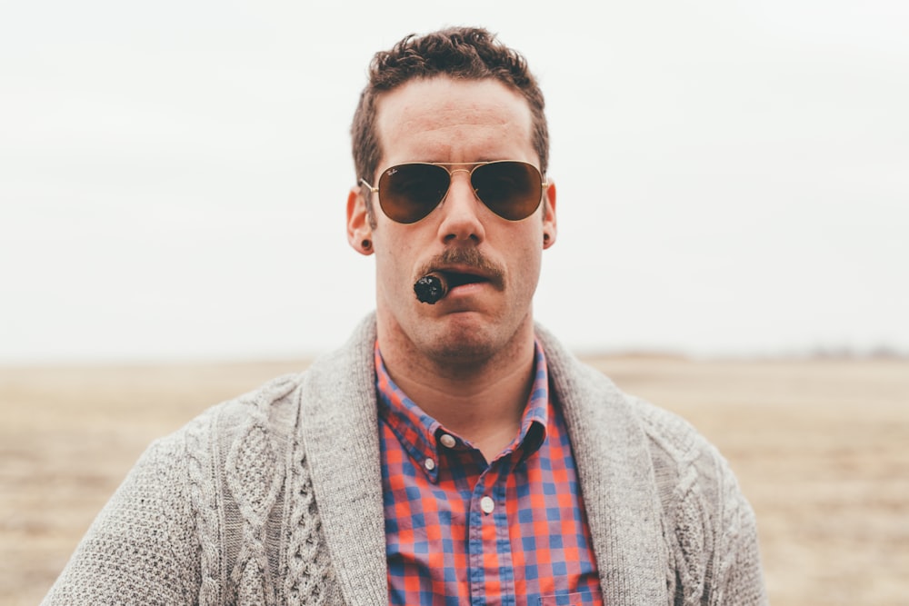 photography of man using tobacco