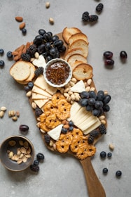 Elegant cheese board featuring assorted cheeses, nuts, and fruits ready for serving.