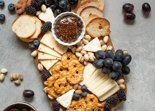 baked breads and cookies on brown wooden board