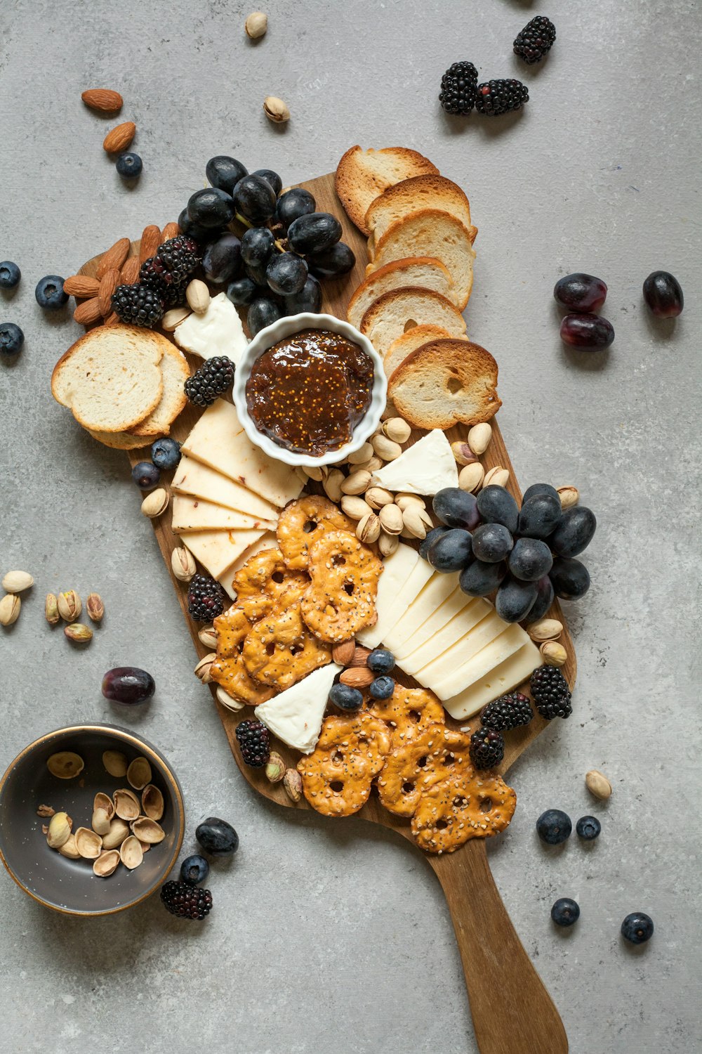 baked breads and cookies on brown wooden board