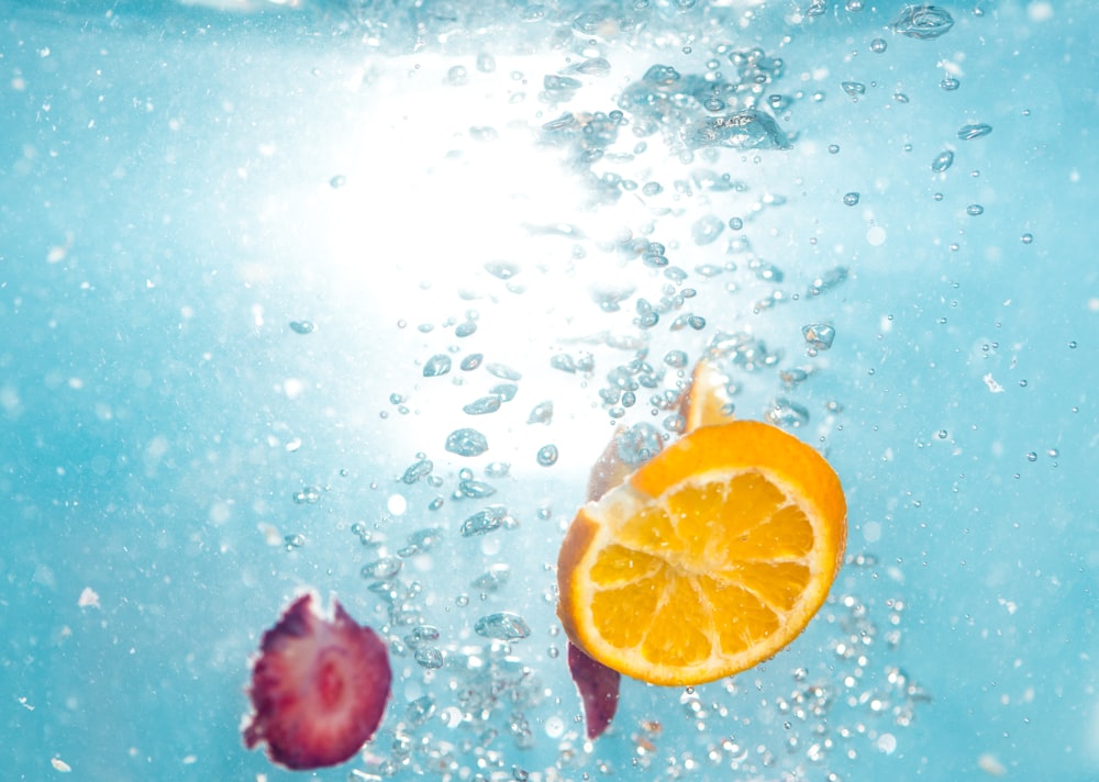 orange lemon fruit under water