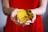 person holding gold-colored ching coins