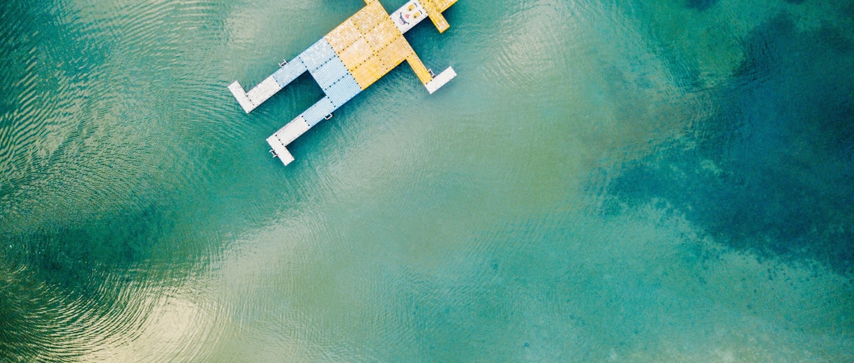 wooden toy floating on body of water