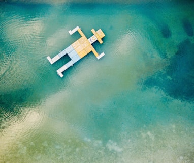 wooden toy floating on body of water