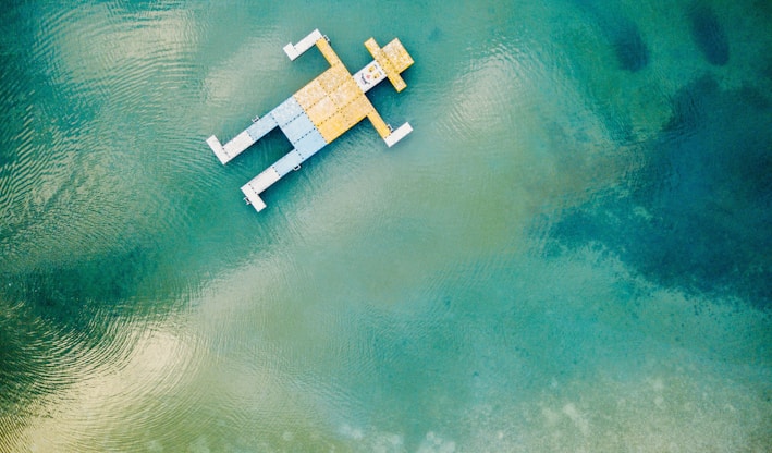 wooden toy floating on body of water