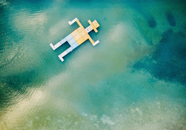 wooden toy floating on body of water