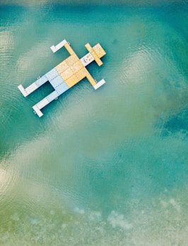 wooden toy floating on body of water