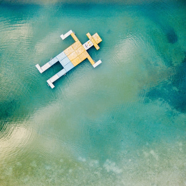 wooden toy floating on body of water