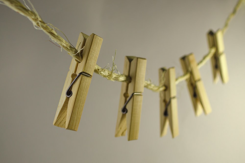 brown wooden clips on brown rope