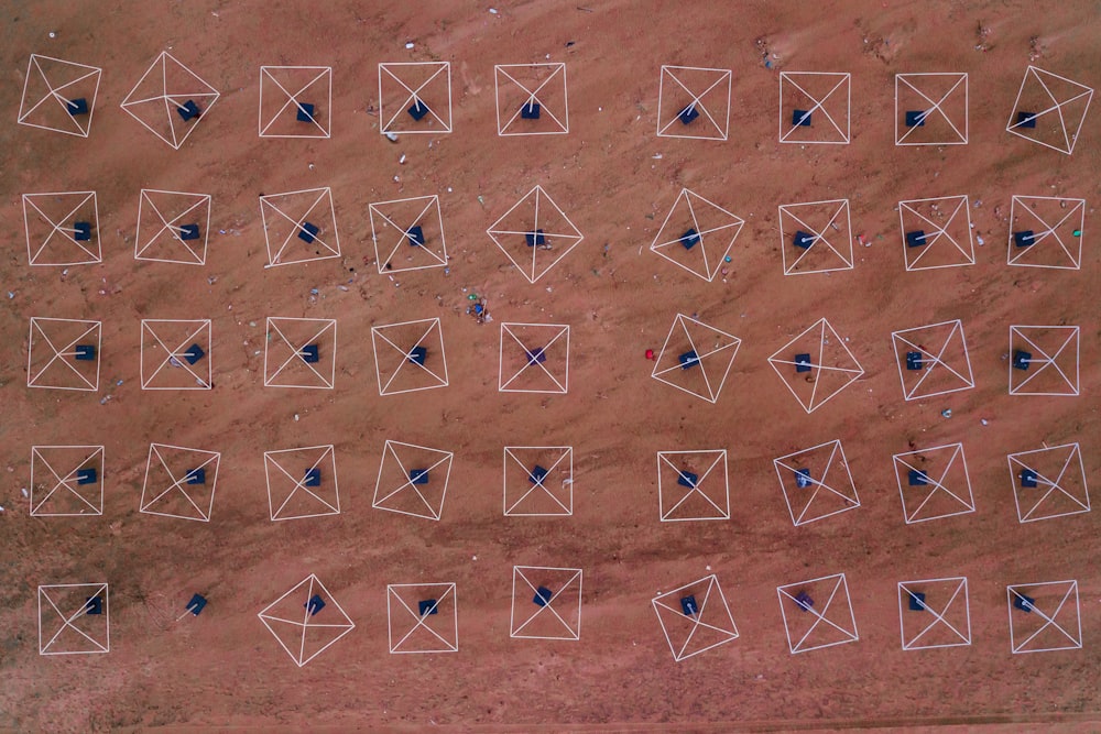 an aerial view of a field with many squares and dots