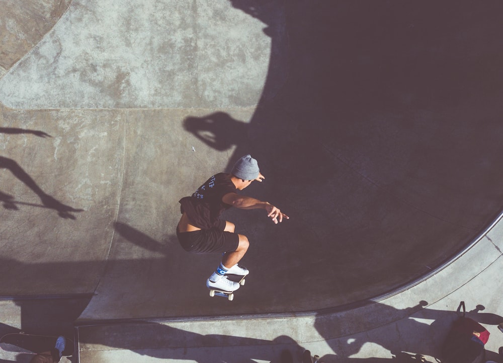 man playing skateboard on skateboard scope
