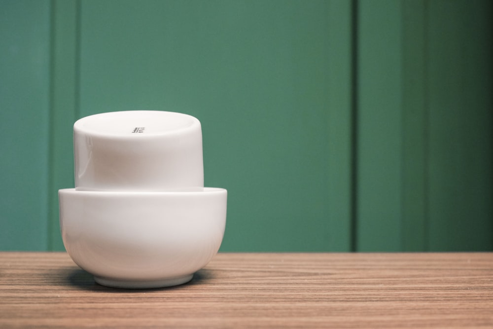 two white bowls on table