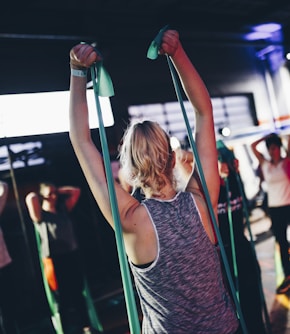 group of people in gym while exercising