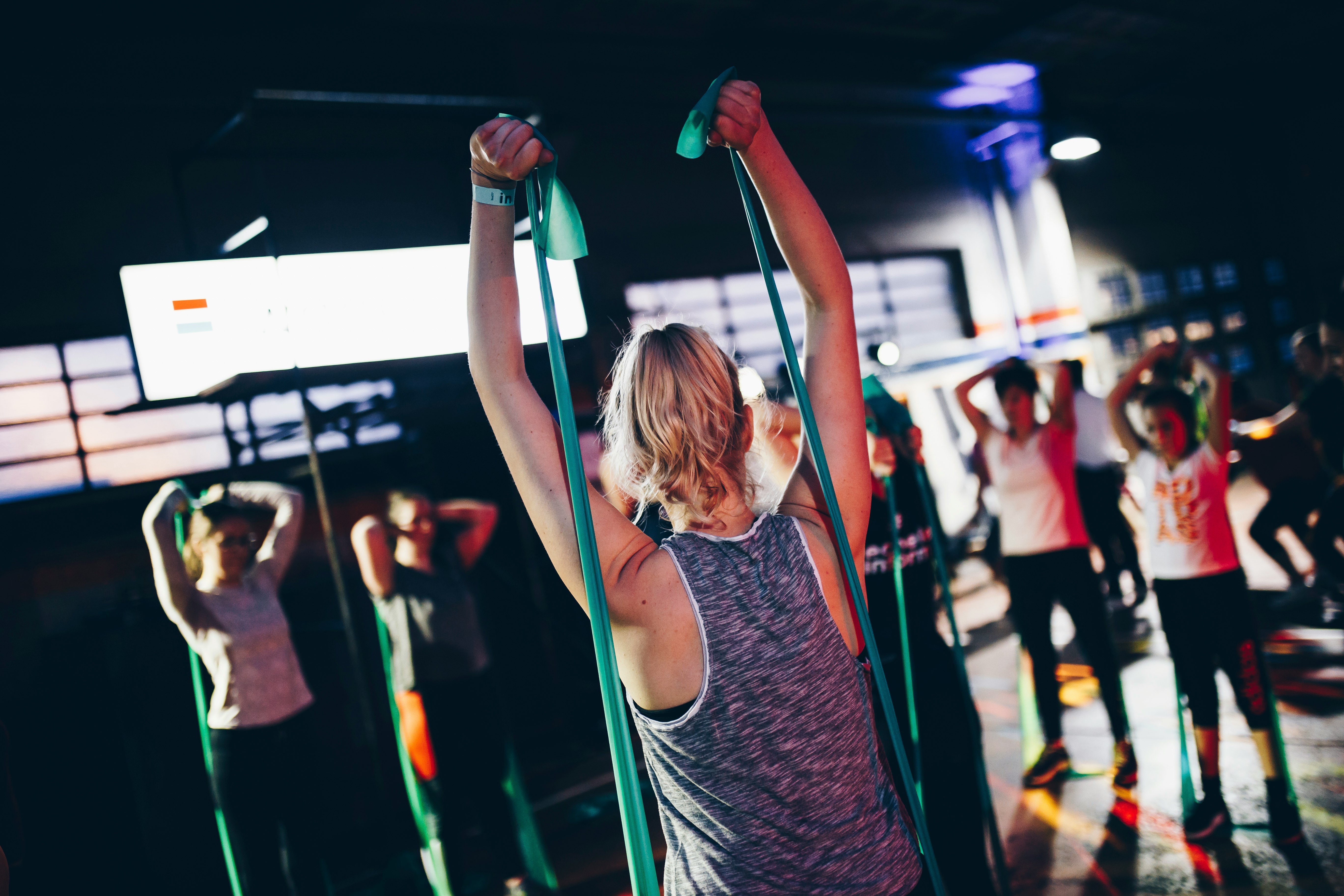 group of people in gym while exercising