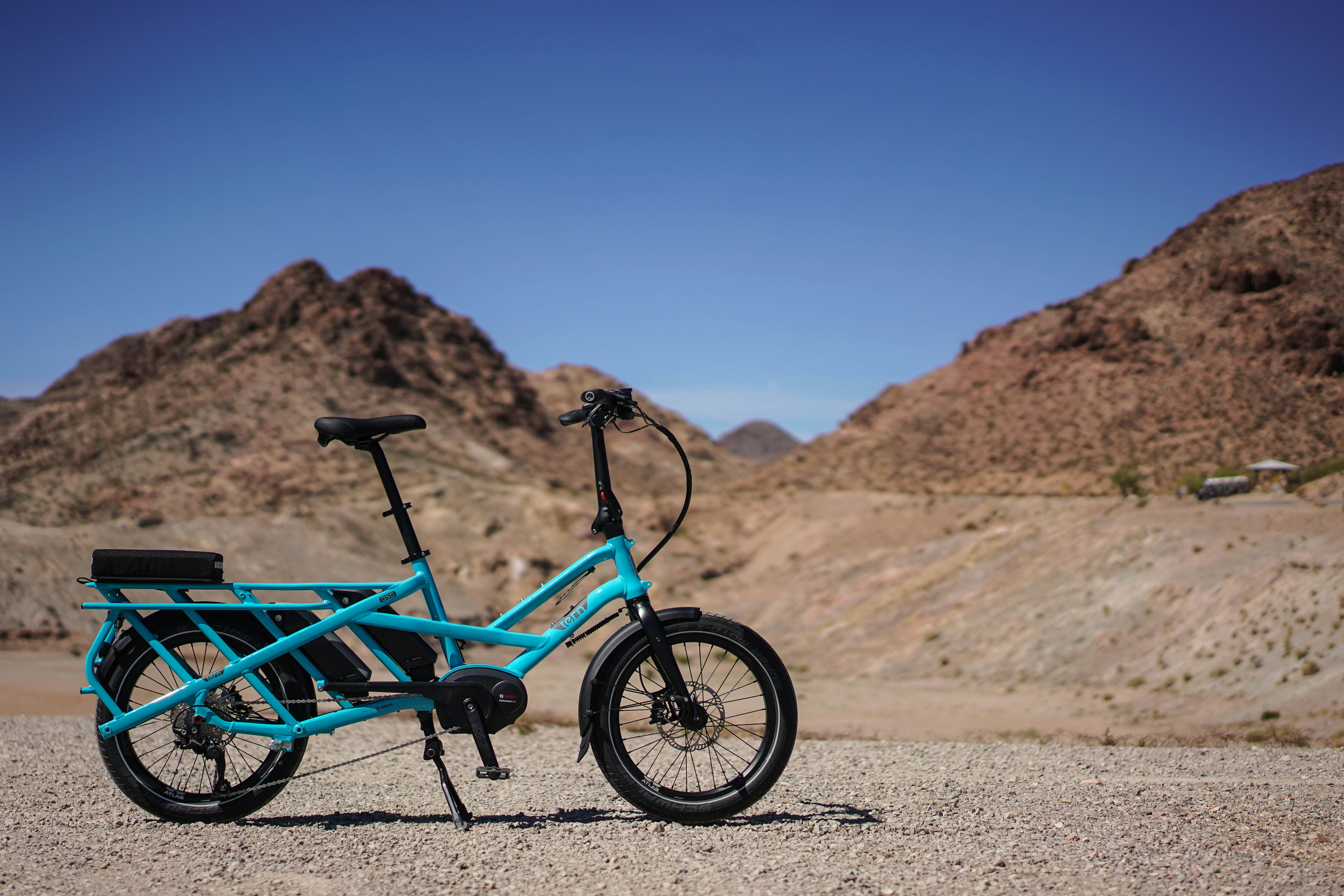 blue bicycle near mountain