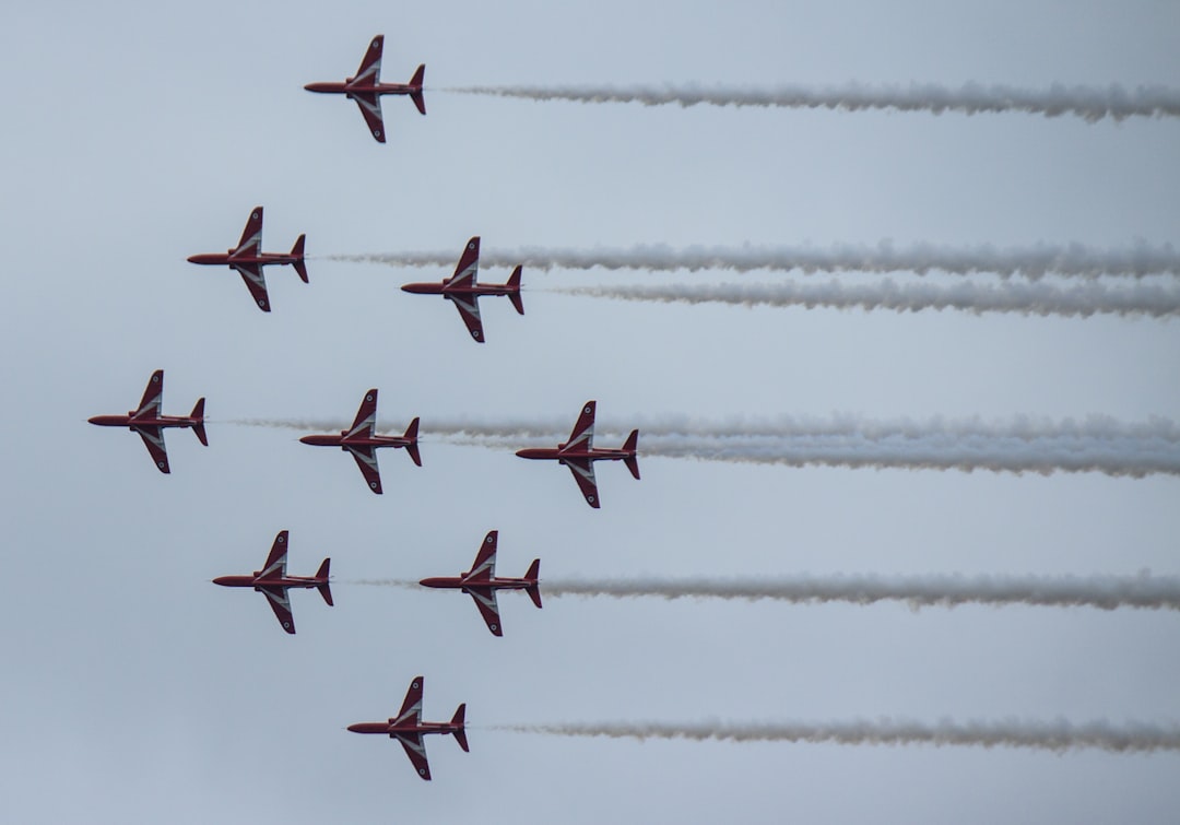 planes doing cloud show, RAF Red Arrows display team with some real precision flying doing the “Diamond 9” formation ove