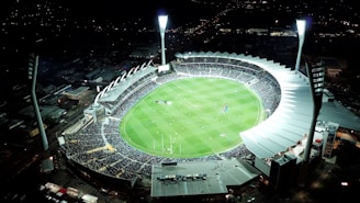 high-angle photo of round stadium at nighttime