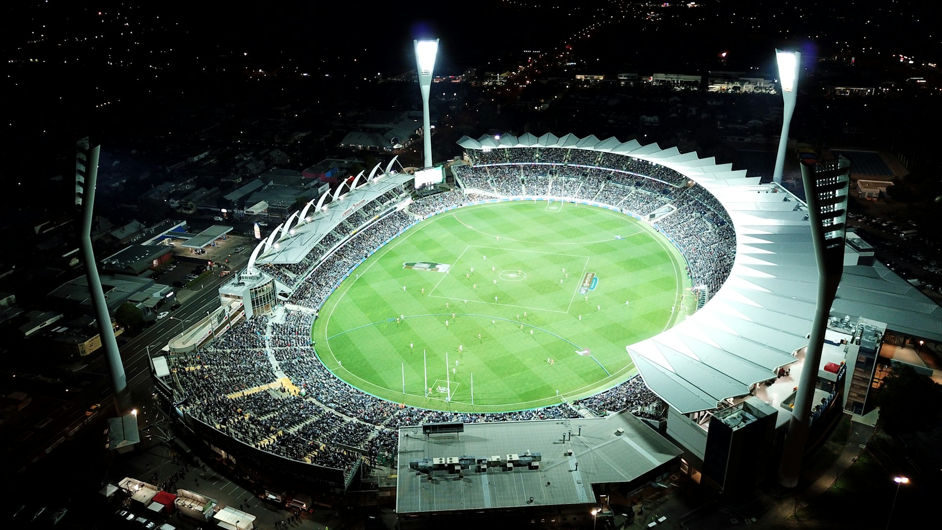 high-angle photo of round stadium at nighttime