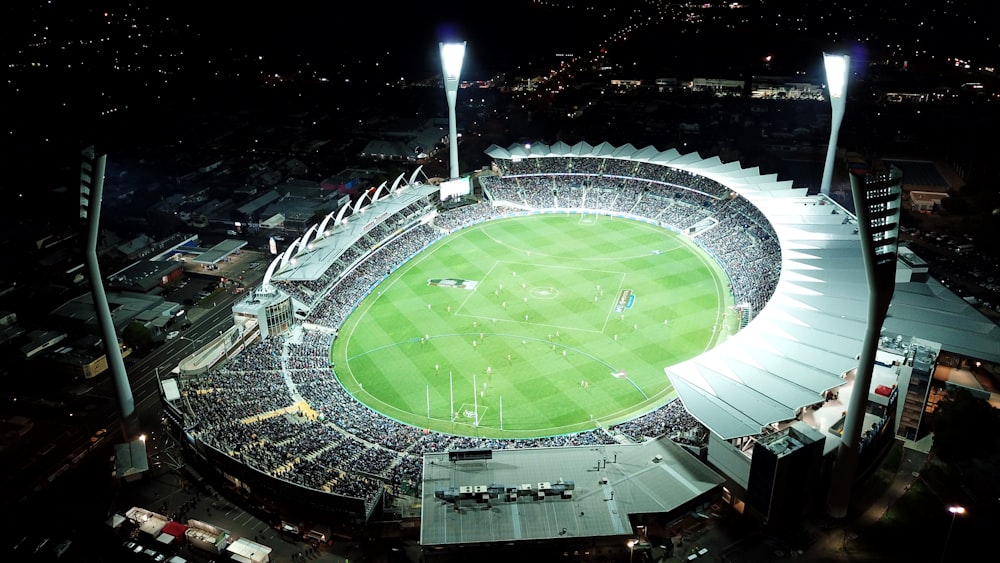 high-angle photo of round stadium at nighttime
