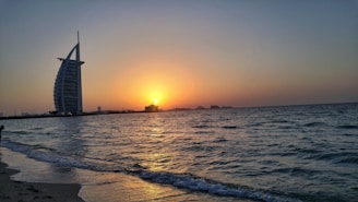 A scenic beachfront property in the Dominican Republic bathed in warm sunset light.