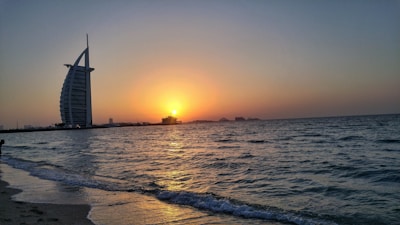 Evening shot of the salon’s exterior glowing warmly against the Sharm El Sheikh skyline.