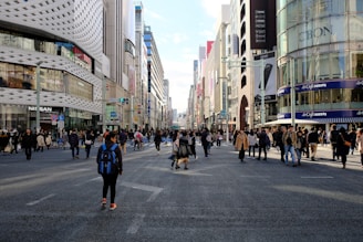 A bustling city street with people wearing The Lion Busness clothing in everyday life.