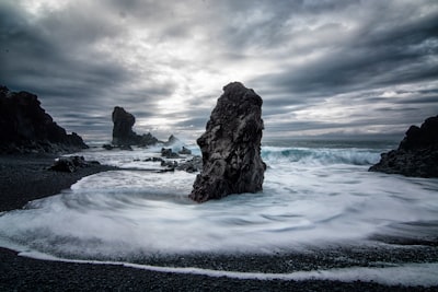 stony beach during cloudy day stormy teams background