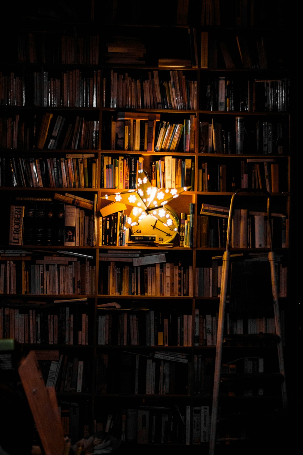 photography of bookshelf and star LED light decor
