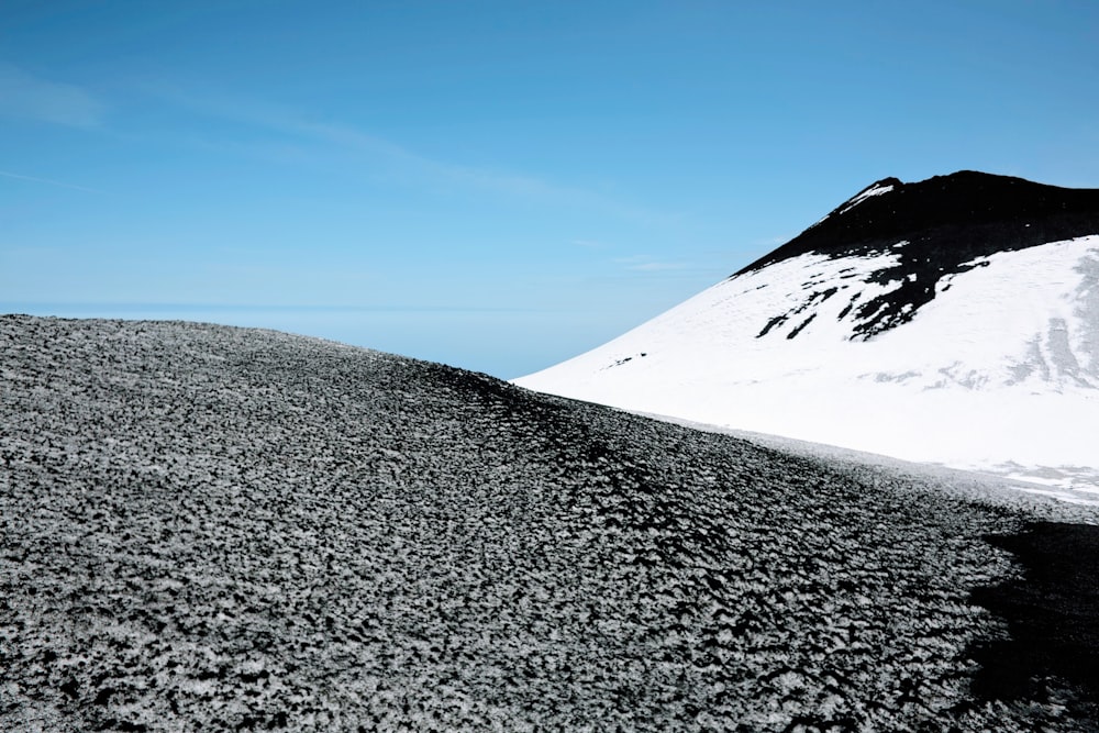 mountain covered by snow during daytime