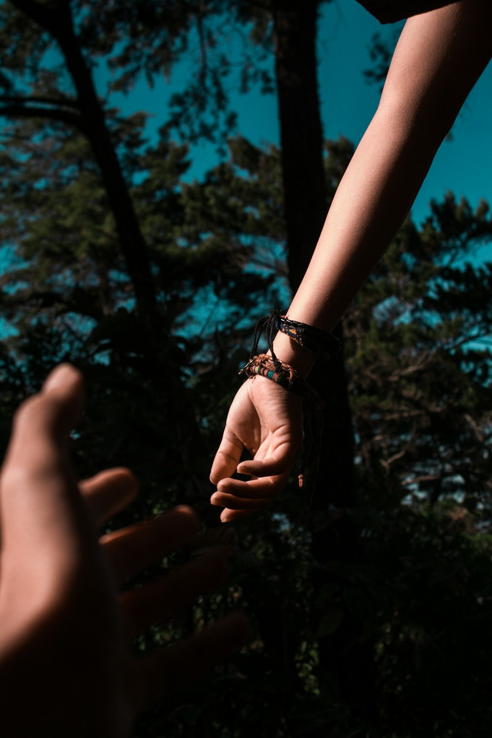 person wearing brown bracelet