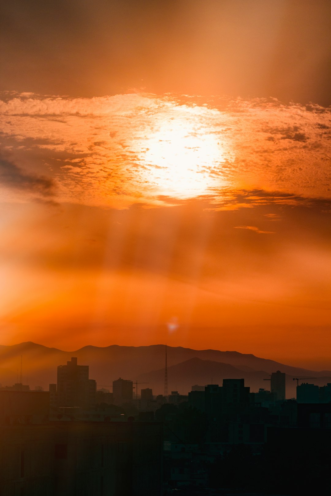 orange sunset above buildings