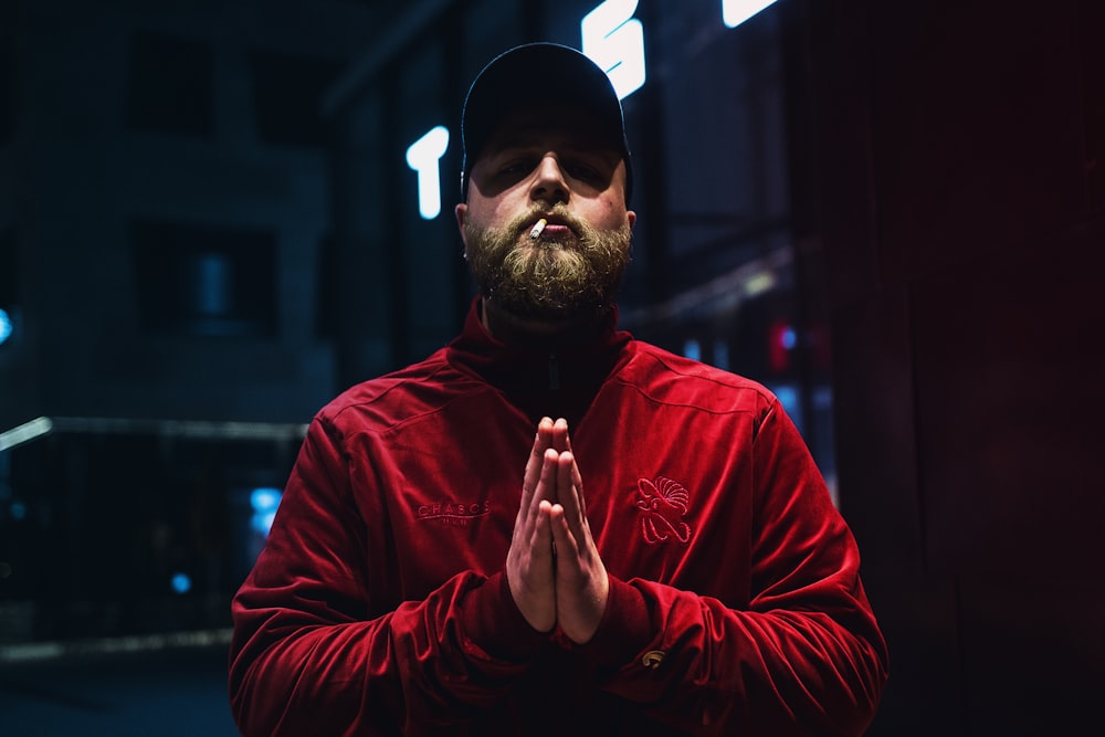 man wearing red sweatshirt