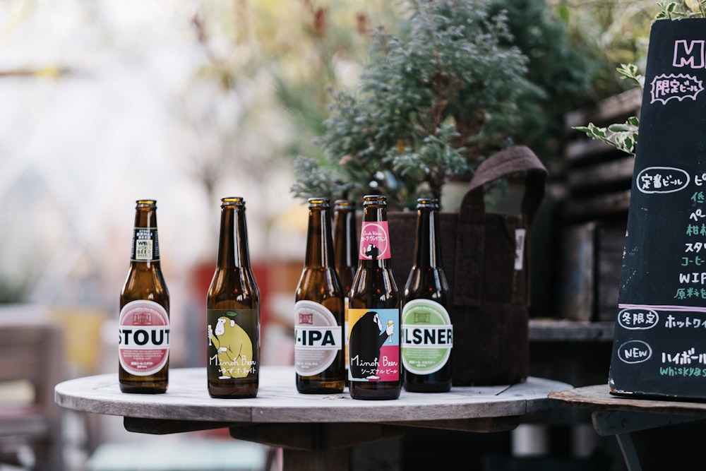 six label bottles on top of round table