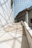 Wide view of the grand staircase bathed in natural light.