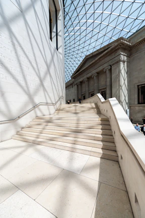 Wide view of the grand staircase bathed in natural light.