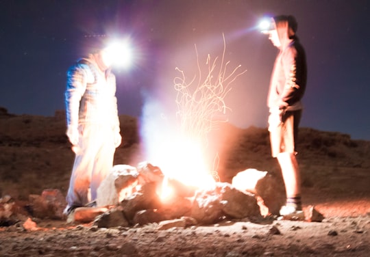 two men standing in front of rocks in Moab United States