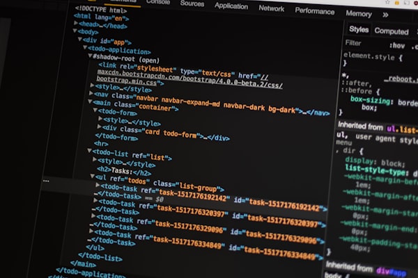 Developer comparing AI coding tool token costs on a laptop