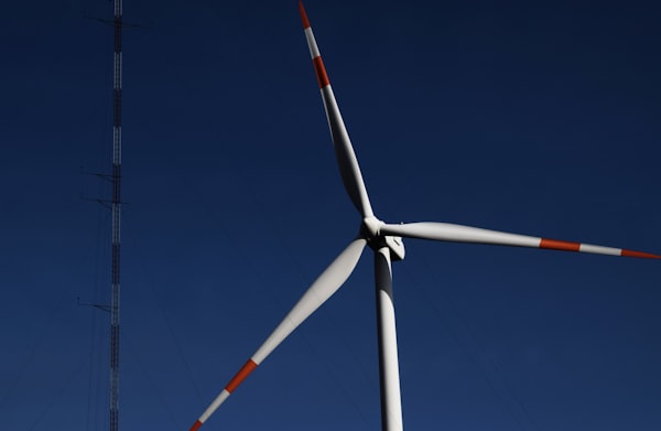 Close view of a wind turbine against the sky