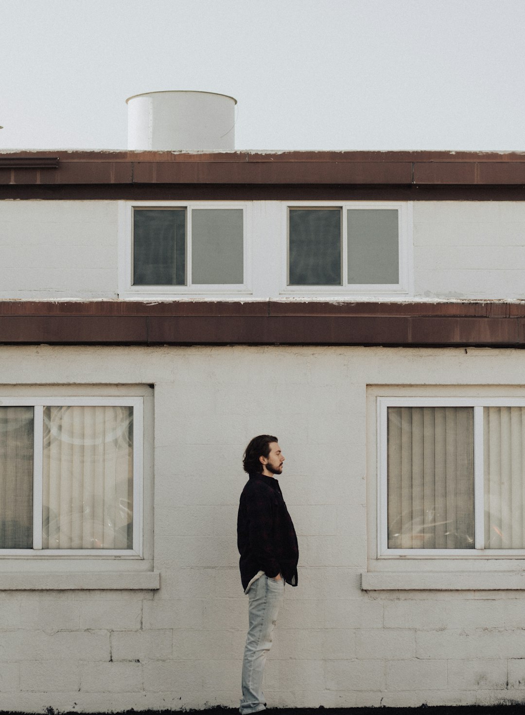 man standing on front of residential building