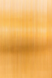 a gold metallic background with vertical lines