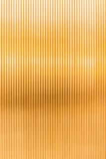 a gold metallic background with vertical lines