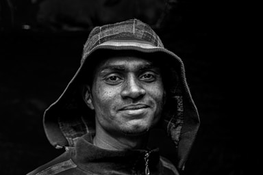 portrait photography,how to photograph a shipyard worker with a hoodie in dhaka, bangladesh.; man wearing hoodie