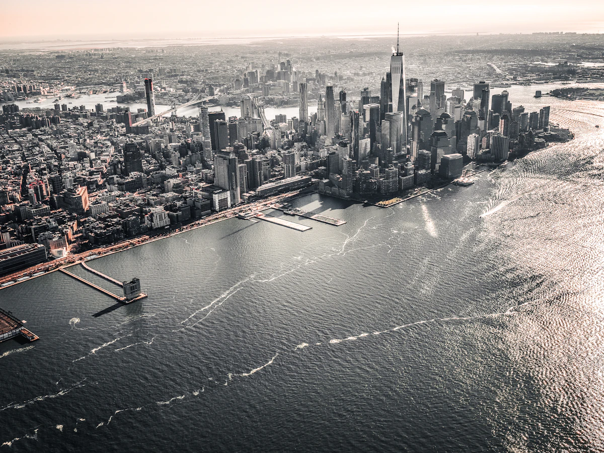 Aerial view of New York City with an aircraft wing in the foreground
