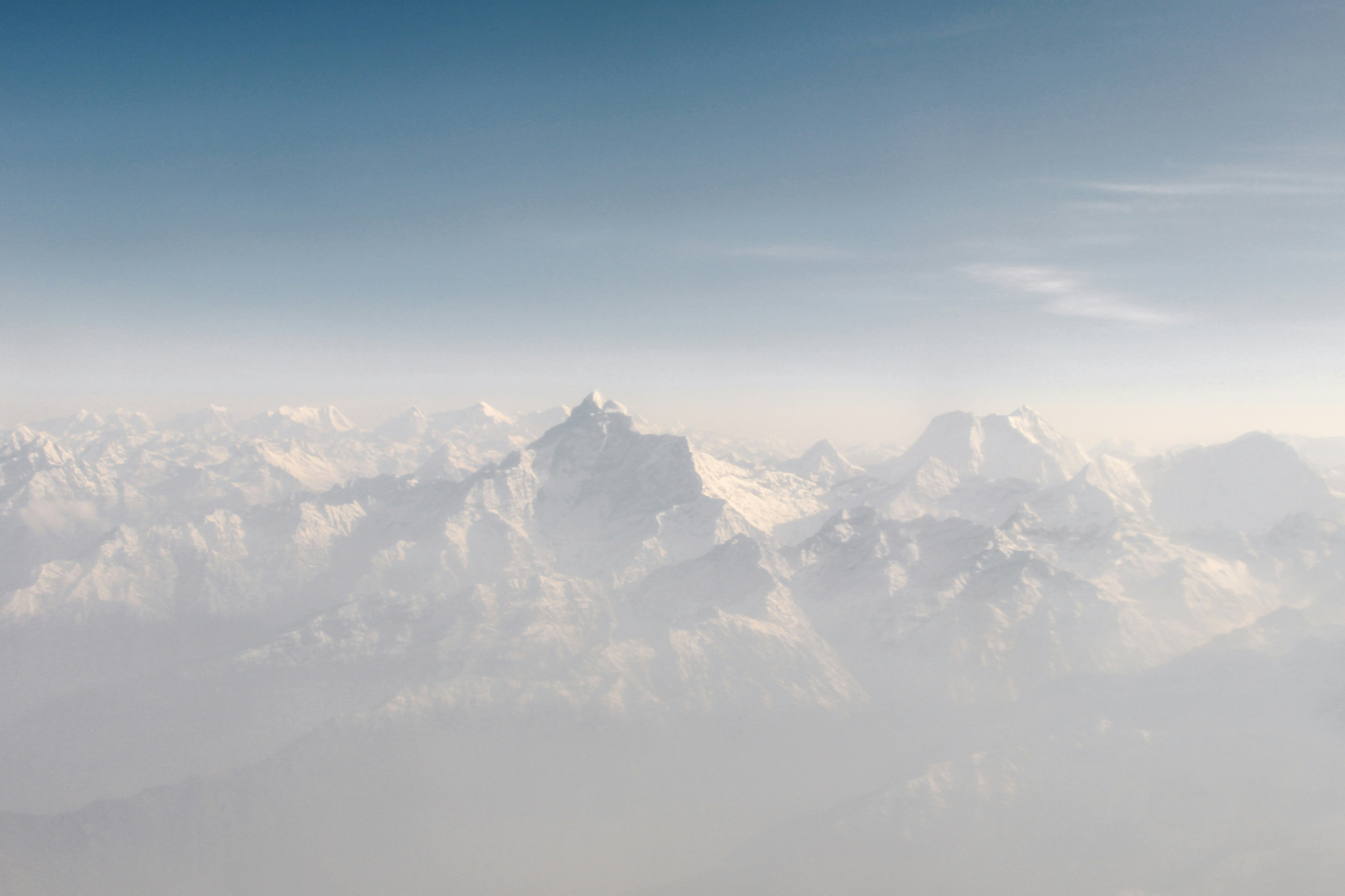 snow cap mountains under blue sky at daytime