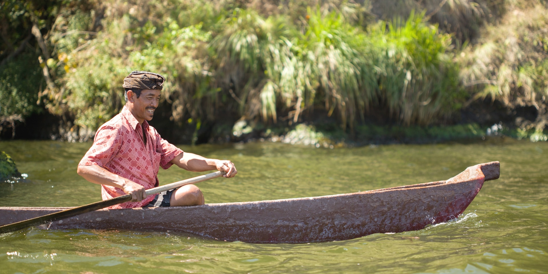 smiling man on boat