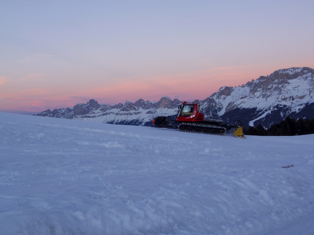 red payloader on snowy field