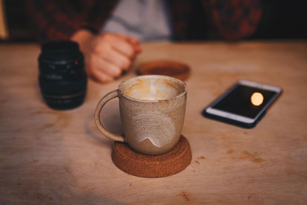 brown cup on brown saucer